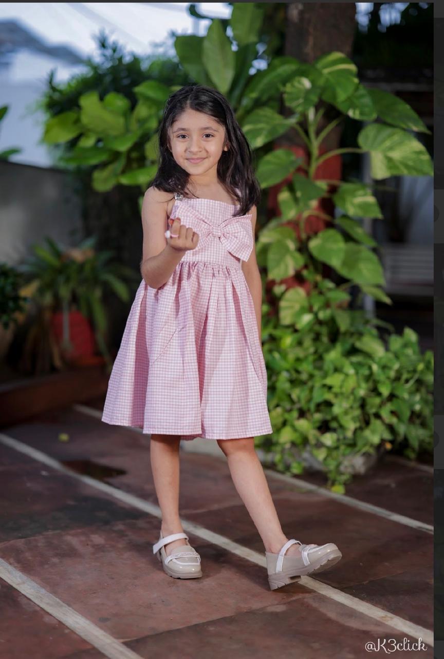Pink gingham dress with bow